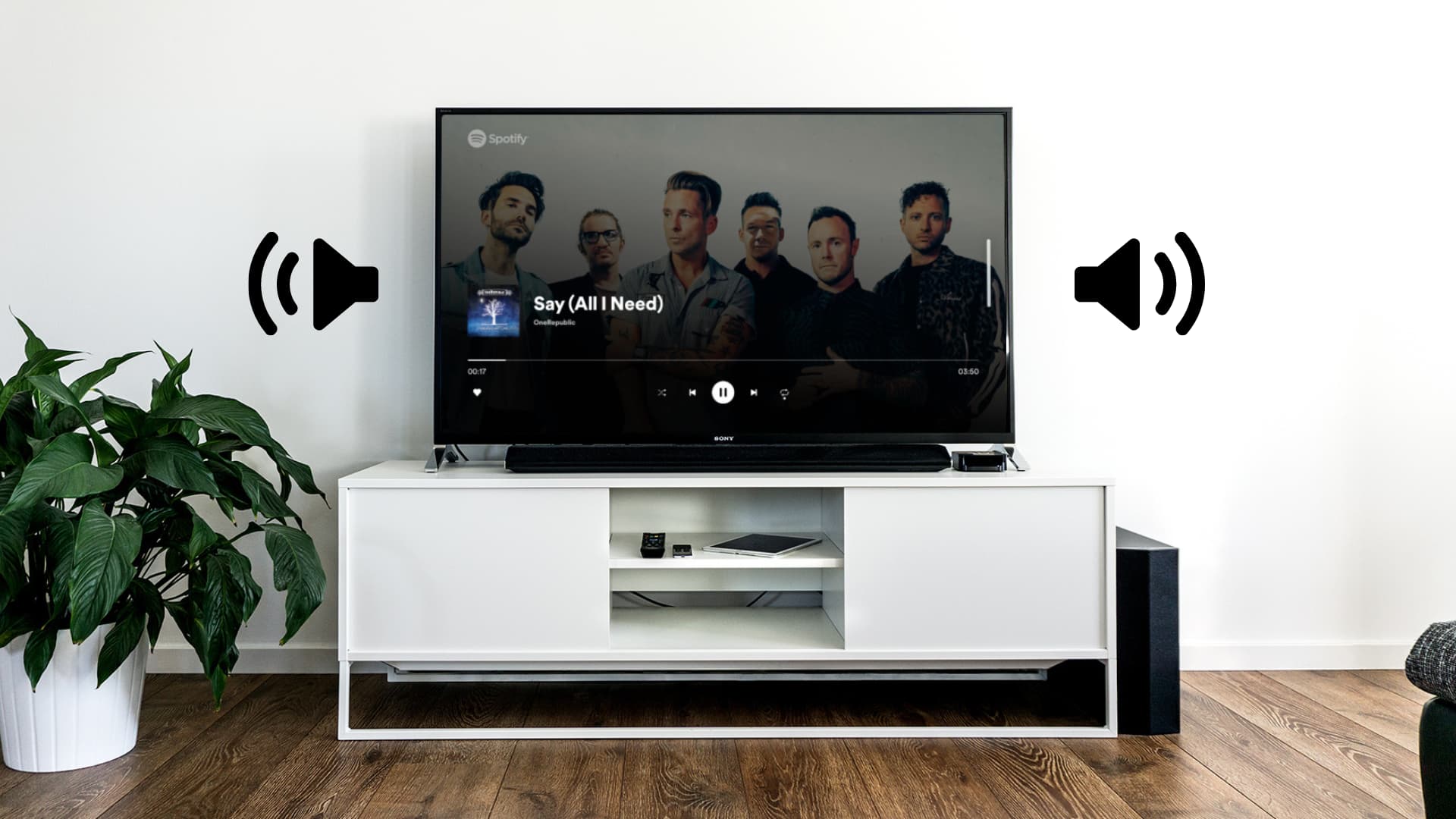 Zimmer mit Fernseher und Apple TV mit zwei Soundsymbolen